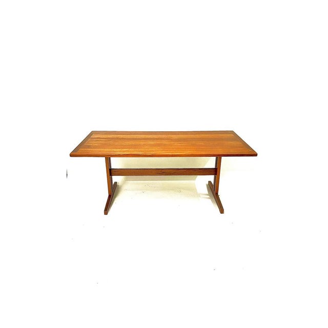 Dining table attributed to George Nakashima, beautifully finished with painted iron inserts. High-quality details....