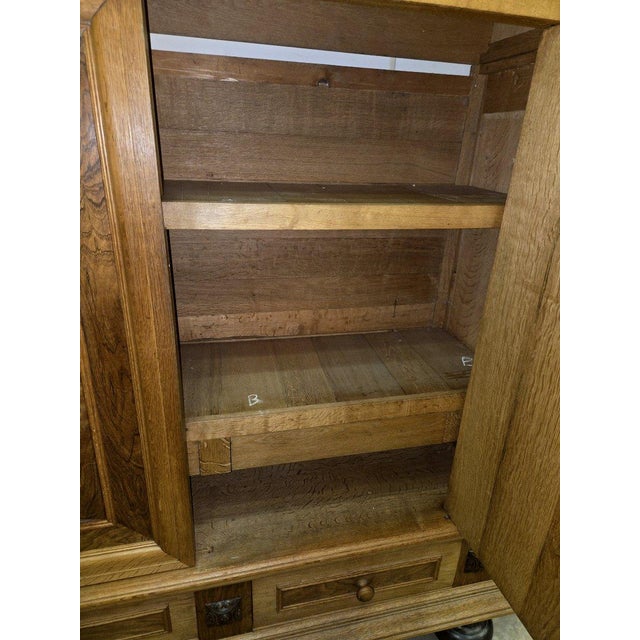 Renaissance-style Dutch "cushioned" cabinet Made of light oak, rosewood, and black lacquer Solid oak frame Opens at the...