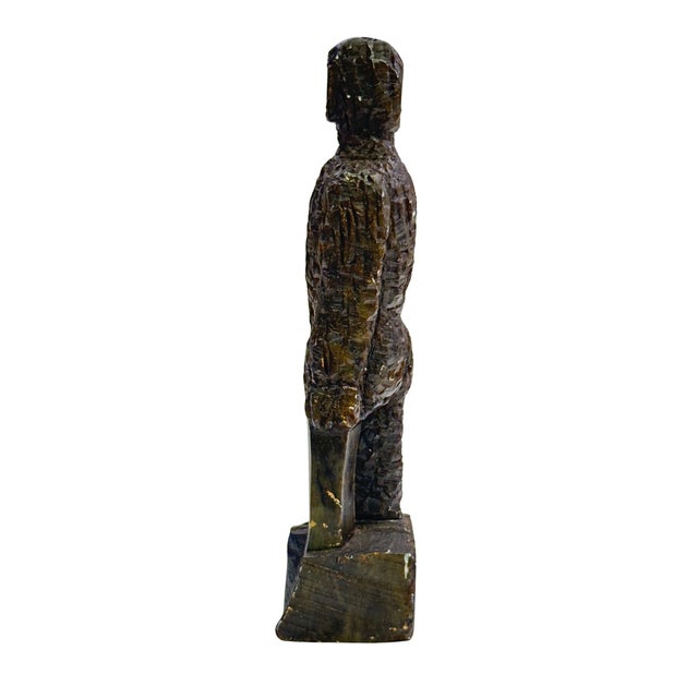 A striking vintage figural sculpture stamped EKIM, hand-carved from stone and rendered in a highly expressive, abstract...