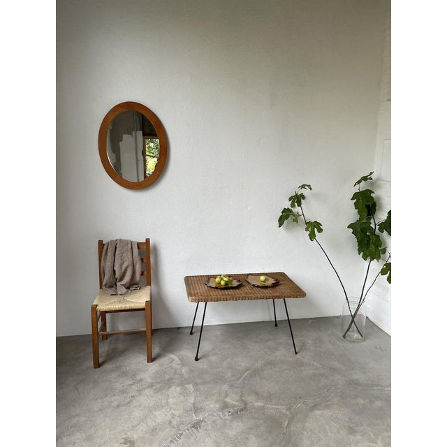 Antique oval mirror with its blond cherrywood frame. Nice details in the wood. Some slight defects in the wood. Two...