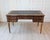 Elegant Louis XVI-style double-sided flat desk crafted in figured wood and accented throughout with refined brass details....