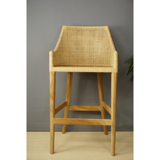 Stools made of a wooden frame and a woven rattan shell