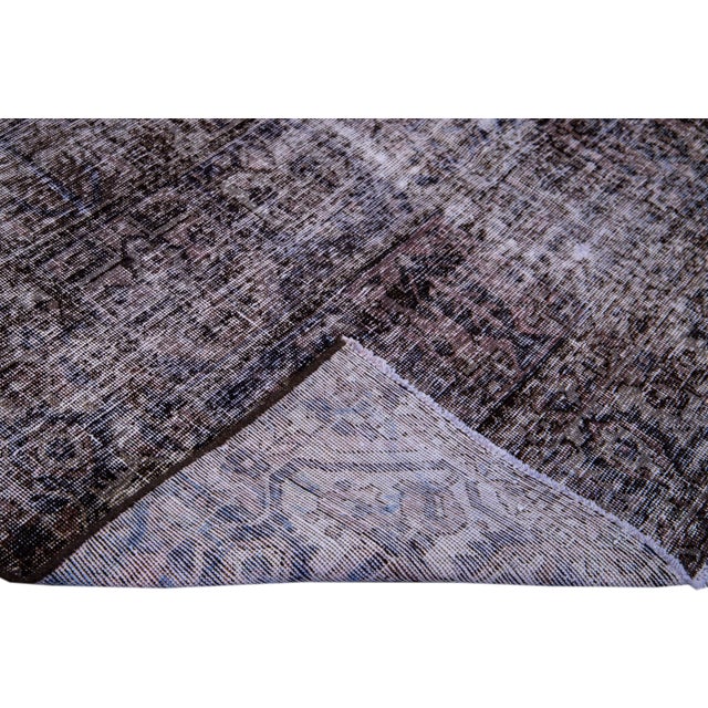 Beautiful vintage Distressed hand-knotted wool rug with a brown field. This Persian rug has gray accents in an all-over...