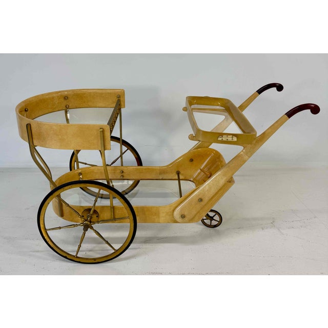 Elegant Italian vintage bar cart attributed to Aldo Tura, dating from the 1960s. The entire structure is wrapped in...