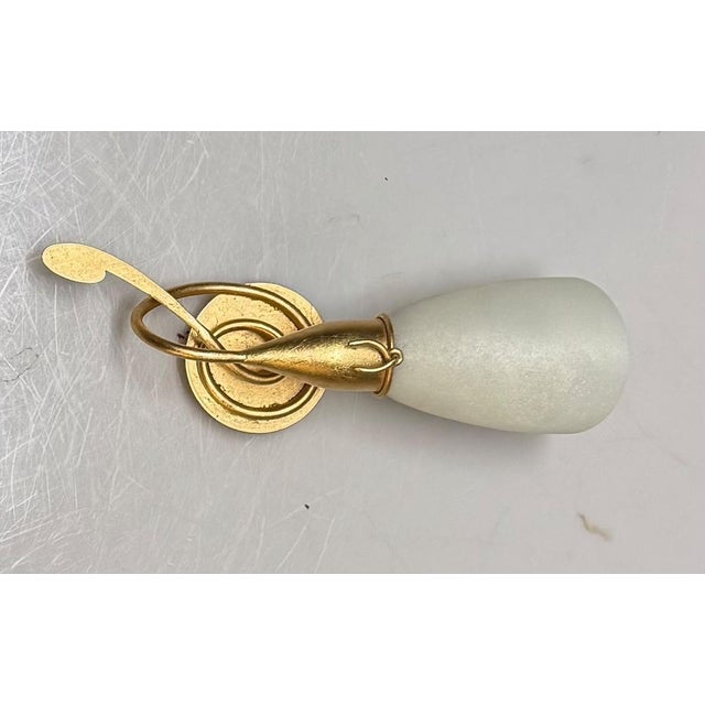 Gold Gilded Wall Sconces with Murano Glass Shades 1980’s Elegant set of two gold-gilded wall sconces dating from the...