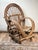 This wonderfully sculptural vintage bent willow arm chair captures the rustic charm and handcrafted character long...