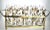 A glamorously stylish Hollywood Regency set of 8 highballs, embellished with high karat gilded butterflies, sun, stars and...