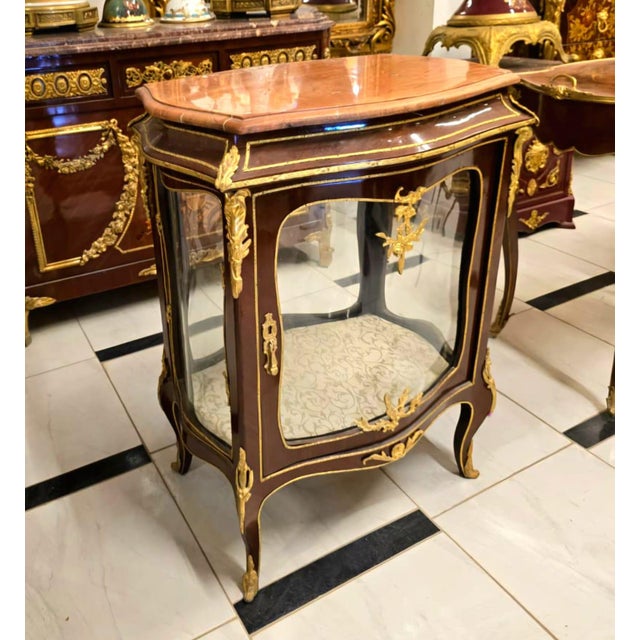 Bring timeless French elegance into your home with this exquisite French Louis XV Curio Display Cabinet, masterfully...