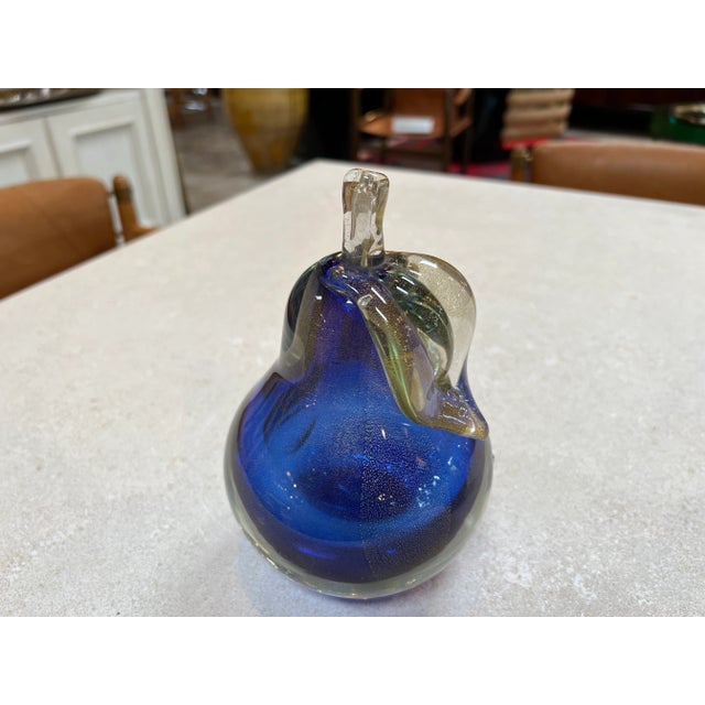 Behold the captivating duo of exquisite decorative objects crafted from the finest blue Murano glass. This enchanting set...