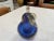 Behold the captivating duo of exquisite decorative objects crafted from the finest blue Murano glass. This enchanting set...