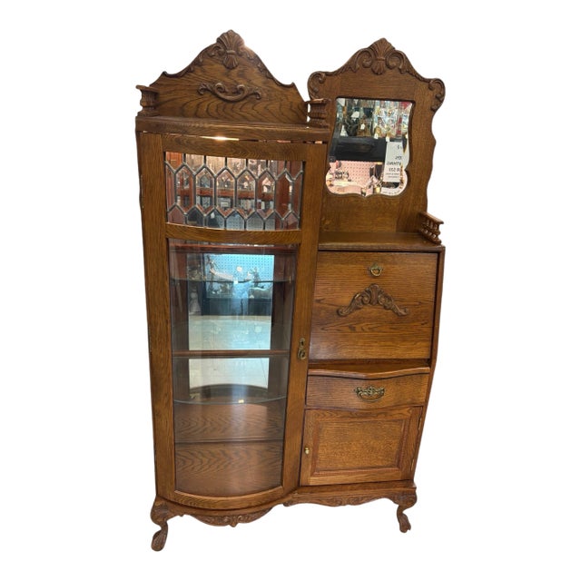 The Antique Oak Secretary Side by Side Bookcase Desk is a Victorian-style piece with a unique design that combines...