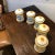 Hand painted ceramic canister in ivory, blue and yellow colors. Hand made items may vary in size, color and pattern....