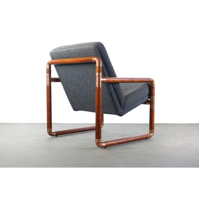 Walnut and brass fitted chair w/ gray tweed upholstery w/ a tufted back detail.