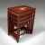 This is a vintage quartetto of nest tables. A Chinese, rosewood graduated occasional table with Mother of Pearl inlay,...