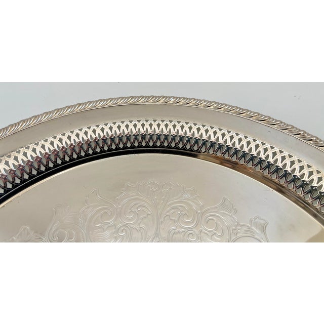 Large embossed Wm. Rogers Siverplate serving tray with beautiful center design. Marked on underside. In excellent vintage...