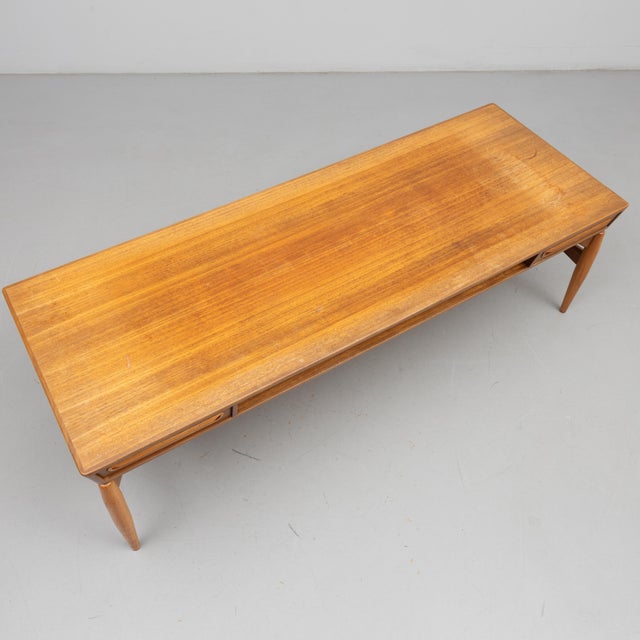 Johannes Andersen teak coffee table for Trensum. Tabletop built on a sculpted stand, made of teak, mahogany and walnut...