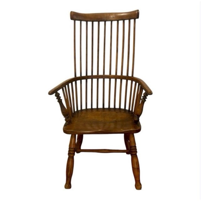 English Windsor chair, circa 1820 (19th century), made of oak, with a high, curved backrest featuring multiple thin...