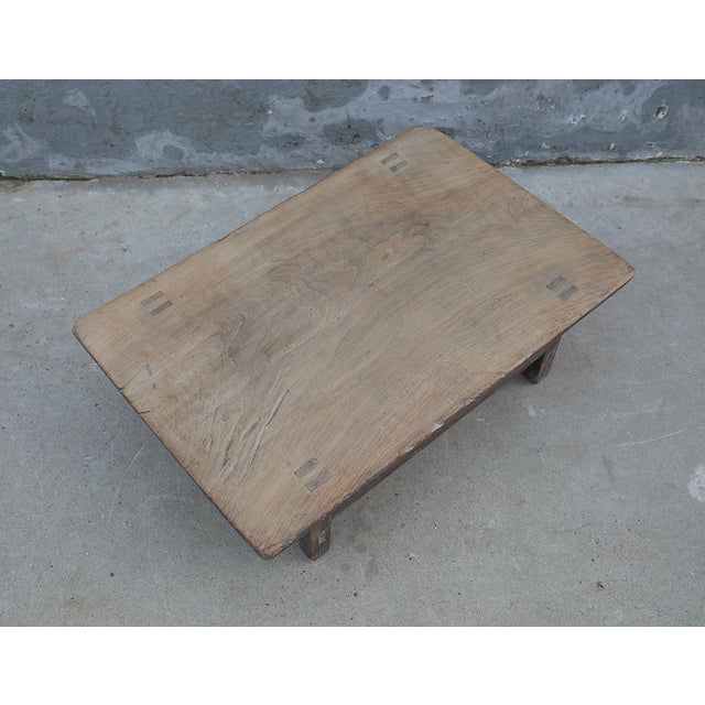 This vintage Chinese elm tea table embodies quiet simplicity and timeworn beauty. Crafted from solid elm with a naturally...