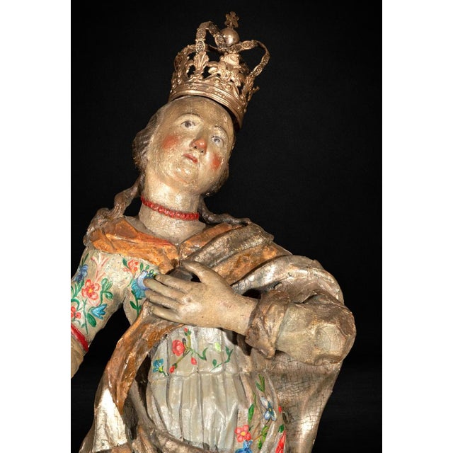 A beautifully carved Spanish sculpture of the Immaculate Conception dating from the 17th century, executed in polychromed...