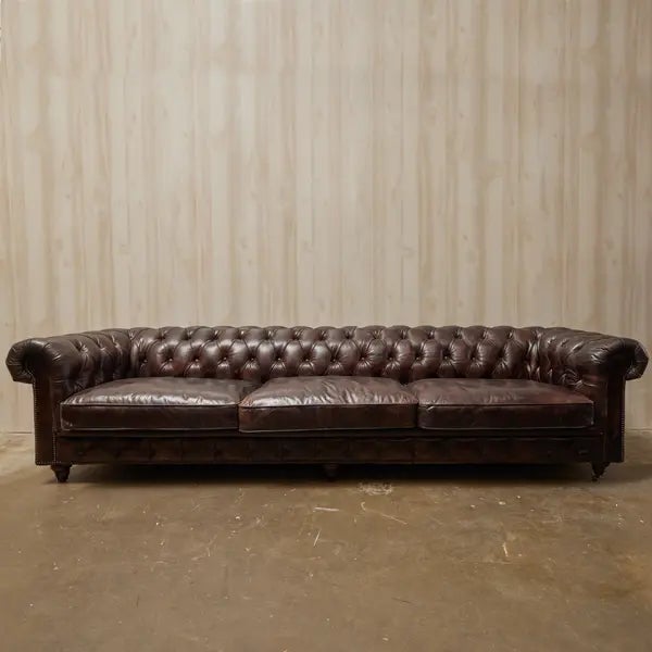 antique brown leather Chesterfield sofa with mango legs. Dimensions L 119" × W 39" × H 29"