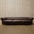antique brown leather Chesterfield sofa with mango legs. Dimensions L 119" × W 39" × H 29"