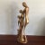 This abstract JART. Resin sculpture depicts a man, a woman, and two children embracing with the oldest child raising up...