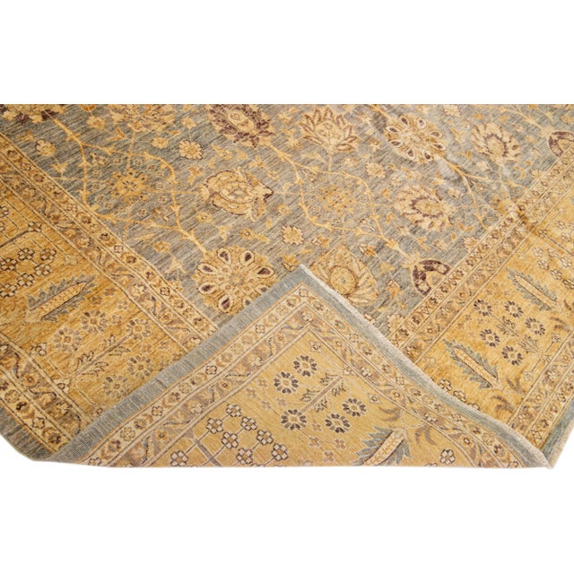 Beautiful Paki Peshawar hand-knotted wool rug with a gray color field. This modern rug has a goldenrod frame with gray and...