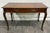 This is a gorgeous and classic vintage Queen Anne style writing desk crafted in a warm cherry finish with elegant cabriole...