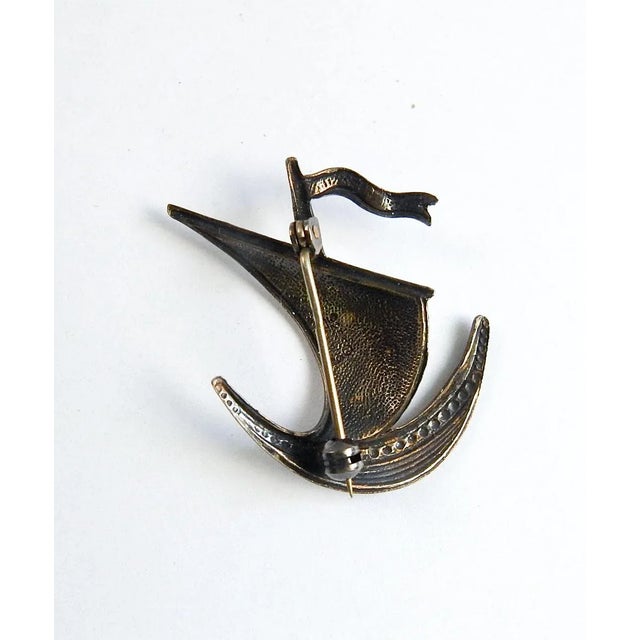 Vintage Ivan Holth, Norway guilloche enamel over sterling silver pin in the shape of a sailing ship. White and blue,...