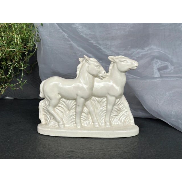 From a rustic country cabin to a sophisticated urban loft, this vintage ceramic Art Deco era white foal horse figurine...