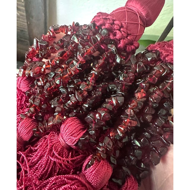 Beautiful pair of vintage curtain tiebacks in rich burgundy silk with hand-strung garnet chip bead tassels. The natural...