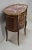 Chiffonnière Kidney veneer of mahogany, top with Red Marble Pyrenees surrounded by a brass openwork gallery. It opens with...