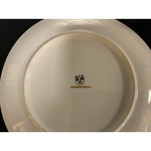 Set of early 20th Century porcelain dinner plates marked MZ Czechoslovakia. Crimson and gilt border. Twelve plates.