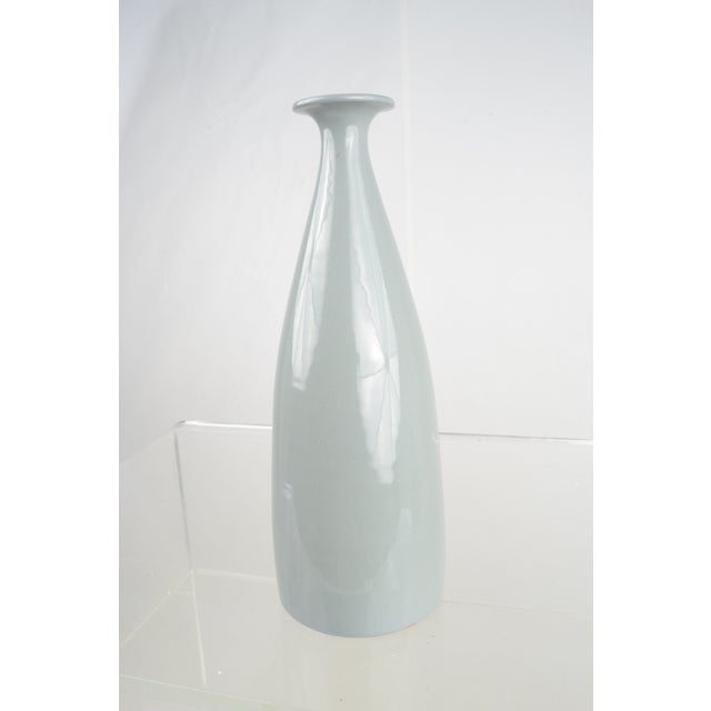 Wonderful color on this Raymor vase. Pale, dusty blue and a luscious glaze.