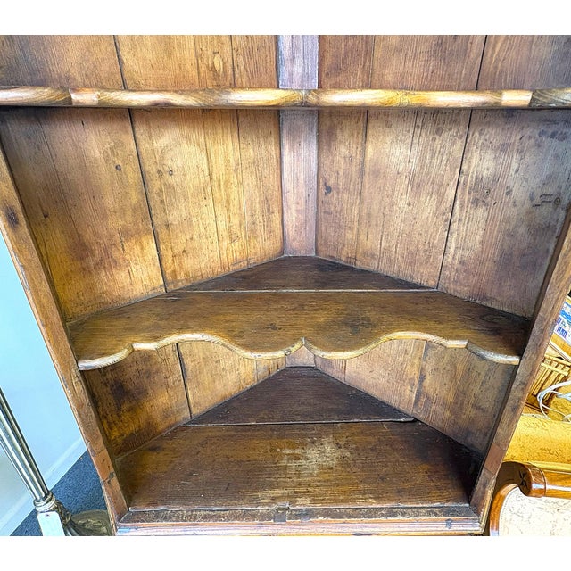 19th Century Rustic American Pine Corner Cupboard With Open Shaped Shelves Over Doors For Sale - Image 9 of 18