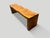 Minimalist teak wave bench. A solid single slab of ancient teak wood is hand carved into a wave style. Both usable and...