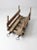 An antique wooden sled with beautifully weathered wood, a natural timeworn finish, and aged iron hardware. Its distinctive...
