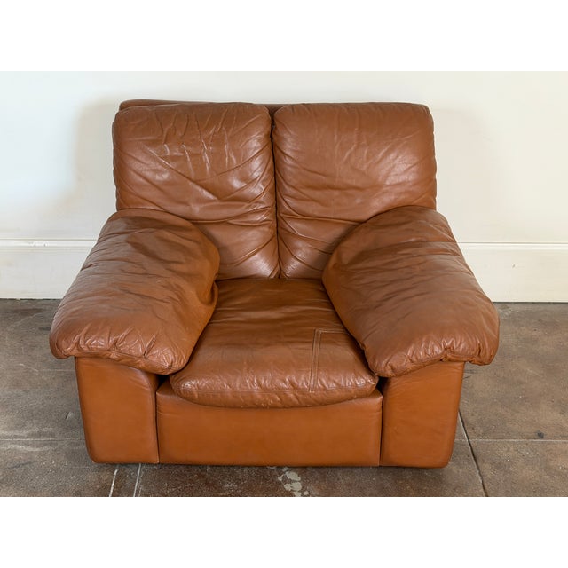 Original brown leather Italian lounge chair in good vintage condition. One repair on the seat cushion (please check all...
