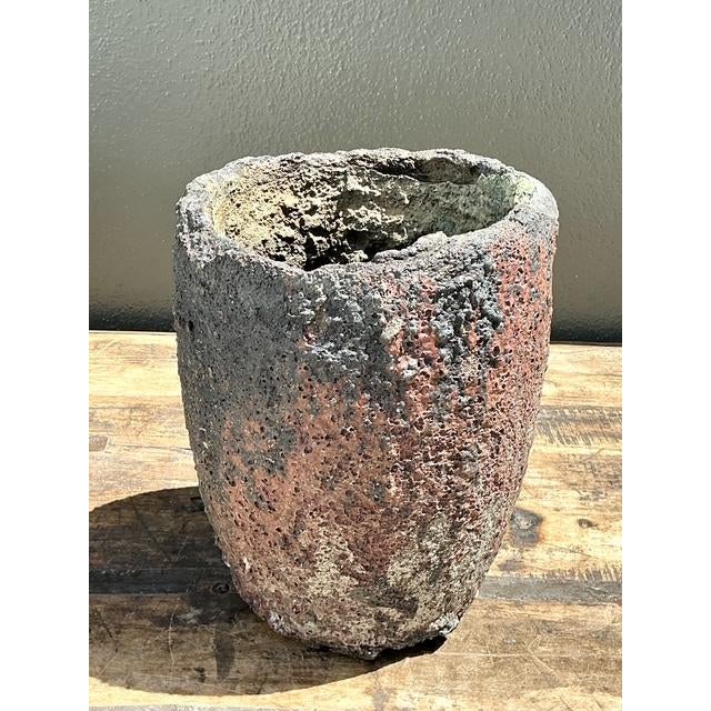 This striking vintage planter is a masterclass in Brutalist expression, featuring a heavily textured "fat lava" glaze that...