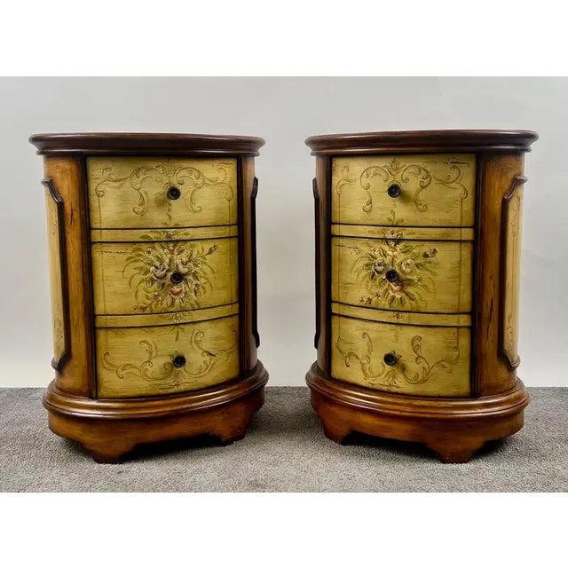 Louis XV Style French Provincial Hand Painted Oval Shaped Nightstand, a Pair This elegant pair of vintage nightstands...