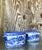 This exquisite pair of vintage Regency-style cache pots is a striking example of timeless blue and white ceramics. Adorned...
