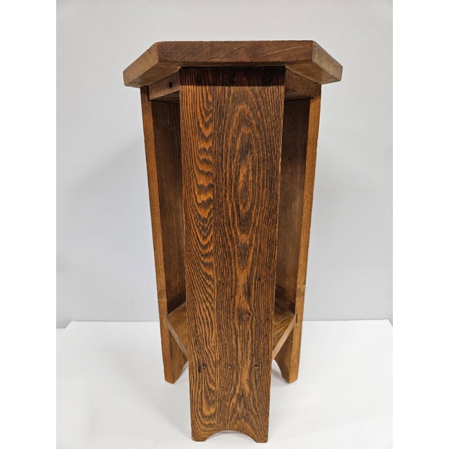 Another classic antique hexagonal oak plant stand with a simple Arts and Crafts, rustic design. This piece is in good...