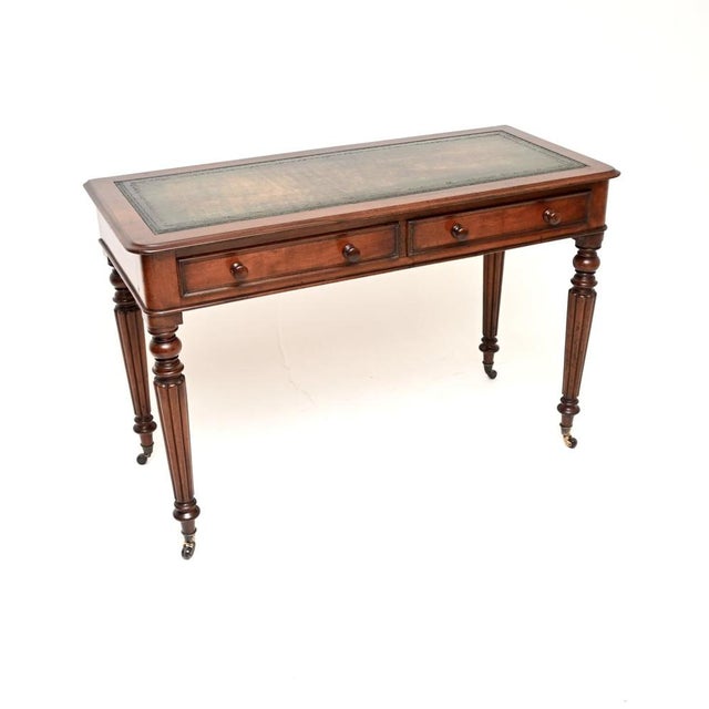 A superb antique Victorian writing table / desk. This was made in England, it dates from around the 1850-1870 period. This...