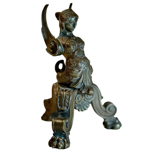 This is an early 19th century bronze whimsy in the baroque style. She is a mermaid with wings has tripod legs with lion...