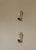 A pair of beautiful vintage brass sconces with beautiful flower shape bobeche (drip tray) made of glass characterized by...
