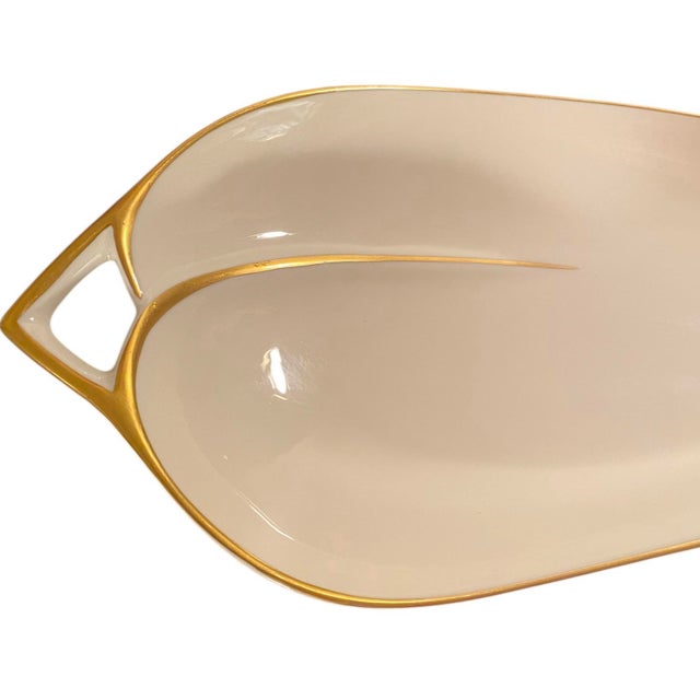 An elegant vintage serving dish by Pickard China, featuring a sculptural leaf-shaped form accented with fine gilt...