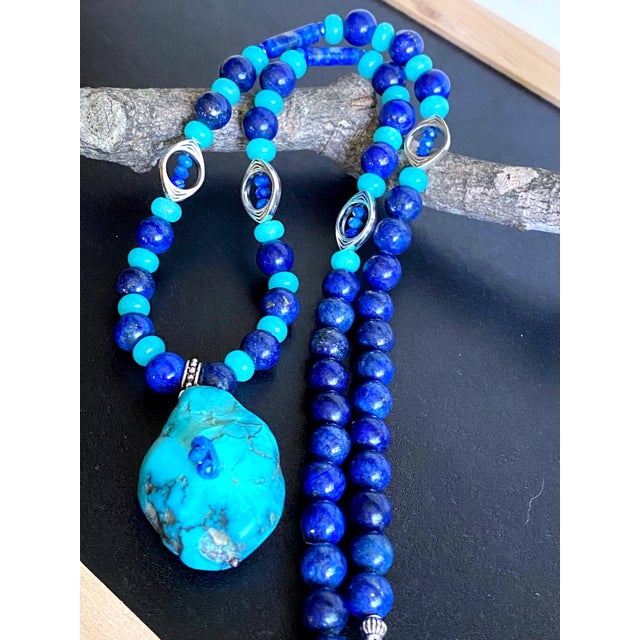 A refined expression of artisan craftsmanship, this one-of-a-kind gemstone necklace combines the rich royal blues of Lapis...