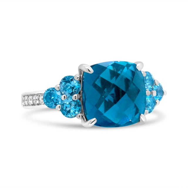 Blue is the new color of love. Wear love on your finger with this stunning blue topaz ring. A 10mm cushion shaped blue...