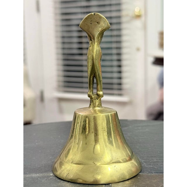 Beautiful and unusual vintage brass bell featuring an intricately detailed anthropomorphic figure inspired by ancient...