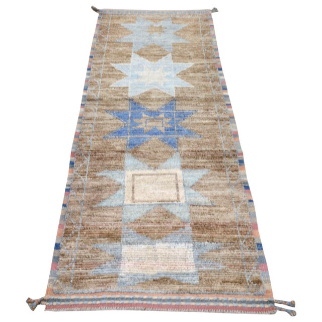 Moroccan Hand-knotted with care using traditional rug-making techniques, this wool rug blends timeless craftsmanship with...